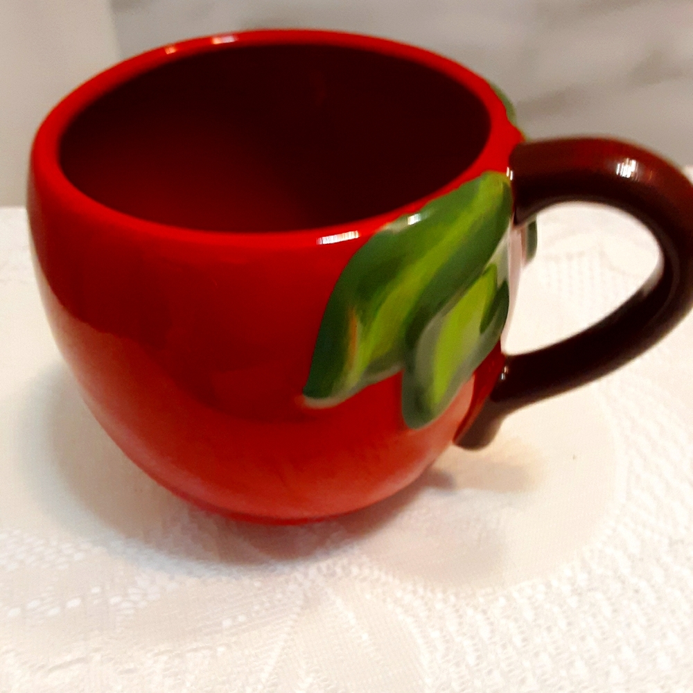 Mug for coffee tea soup. Red apple